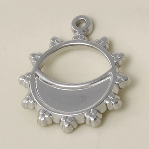 Macro shot of silver 304 stainless steel round hollow sun pendant with crescent moon tray