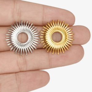 304 stainless steel hollow sunburst stud earrings in gold and silver finish on hand