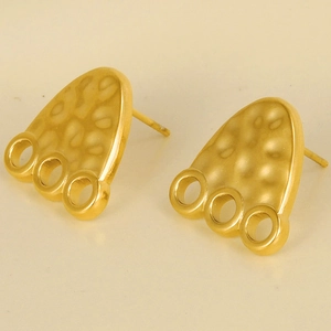 Detail of 18K gold-plated earring featuring a hammered texture and three small hollow rings
