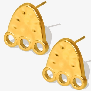 Detail of 18K gold-plated earring with hammer texture and three small ring charms