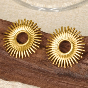 Detail of 18k gold plated stainless steel sunburst stud earrings on wooden display