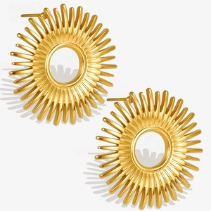 Macro view of 18k gold plated sunburst stud earrings with radial sun ray design