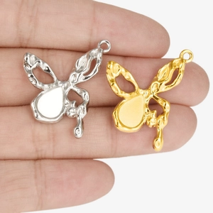 Butterfly metal pendants in gold and silver colors with fluid lava texture and hanging loops