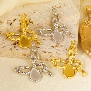 Artistic butterfly pendants in gold and silver with organic lava texture and water drop inlay