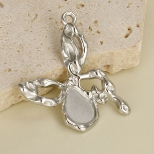 Macro view of 304 stainless steel butterfly pendant with waterdrop inlay base for DIY crafts