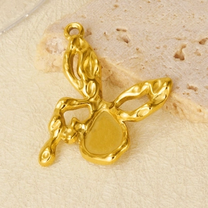 Macro detail of a 304 stainless steel butterfly pendant with lava texture and golden finish