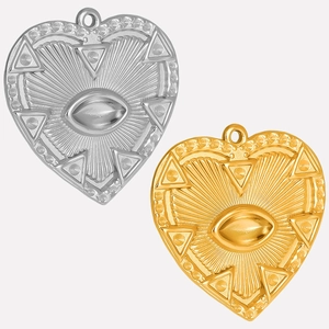 Macro detail of heart-shaped all-seeing eye pendants in gold and silver stainless steel