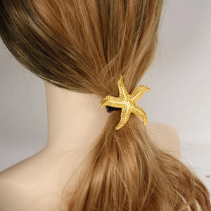 304 stainless steel golden starfish hair tie with black elastic band on model hair