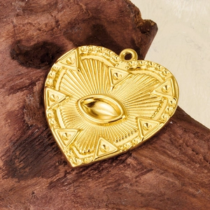 Bohemian gold stainless steel heart pendant with sunburst eye design on wood background