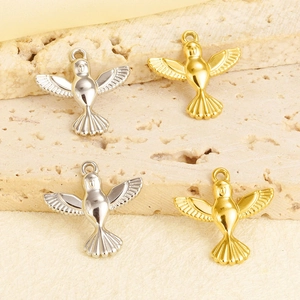Detailed view of polished stainless steel hummingbird pendants in gold and silver finish