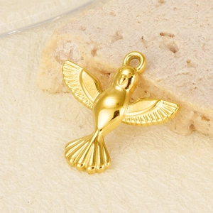 Macro detail of 304 stainless steel hummingbird pendant with gold-plated wing textures