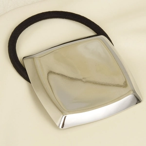 Detail of minimalist 304 stainless steel square metal charm on black hair tie elastic