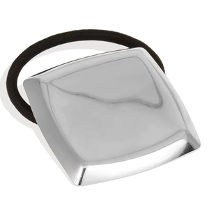 Macro shot of minimalist silver polished square charm on an elastic black hair tie band