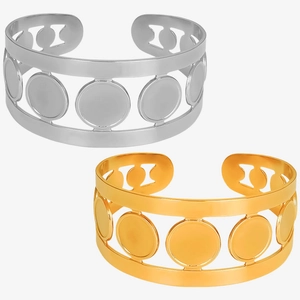 Macro shot of gold and silver cutout bangles with round disk charms in 304 stainless steel