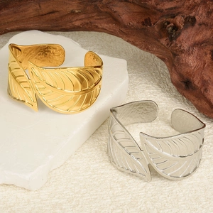 Adjustable 18K gold and silver leaf open cuff bracelet in a naturalistic style
