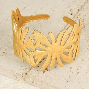 Polished 18K gold plated stainless steel open bangle with tropical leaf cut-out design
