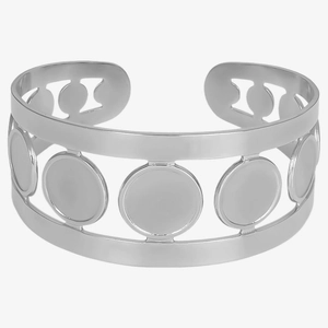 Macro view of wide 304 stainless steel open bangle with circular cutouts in silver