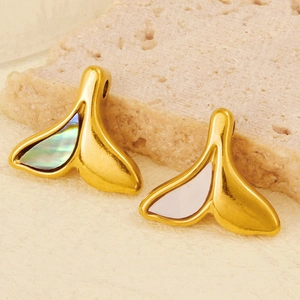 Macro shot of 304 stainless steel fishtail charms with white shell and abalone shell inlays