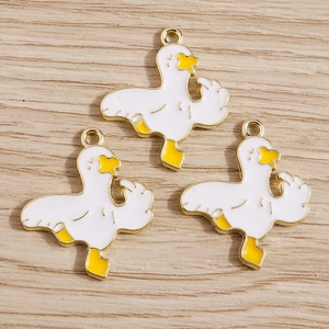 Funny alloy enamel duck charms with humorous gesture on light wood background