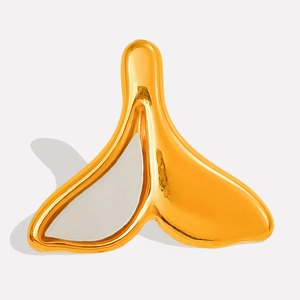 Macro detail of golden fishtail pendant with mother of pearl inlay and fluid metal design