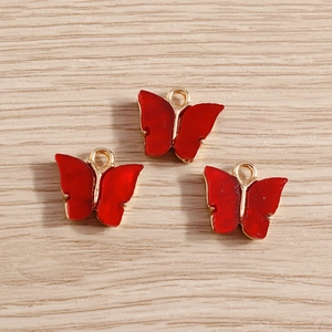 Drei rote Schmetterlingsanhänger aus Acryl mit Goldrand für DIY-Schmuckherstellung