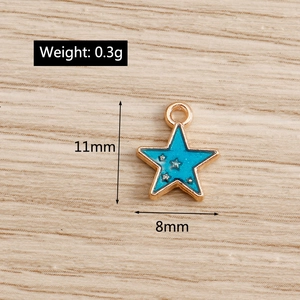 Detail view of small blue enamel star charm with 11x8mm size and 0.3g weight specifications