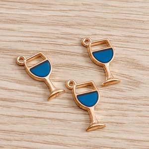 Set of 3 blue enamel gold alloy wine glass charms for DIY jewelry making on wood background