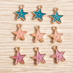 Detail of star-shaped enamel alloy pendants for DIY jewelry making in assorted colors