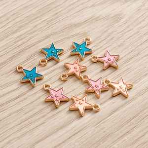 Colorful enamel star pendants with gold metal edging for DIY jewelry making and crafts