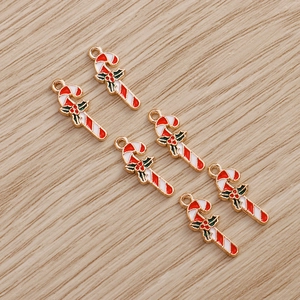Set of 6 Christmas candy cane charms with red white stripes and green holly for DIY jewelry