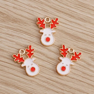 Close-up of cute cartoon Christmas reindeer alloy pendants for DIY jewelry making