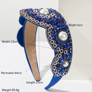 Detailed view of Baroque headband with sapphire crystals and pearls on velvet