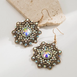 Detail of vintage flower drop earrings with bronze metal and colorful AB rhinestone