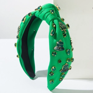 Green St. Patrick's Day headband with clover and hat charms for festive party