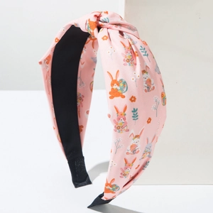 Close-up of pink Easter headband with cute bunny prints and black non-slip lining