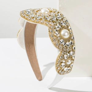 Detail of luxury baroque wide headband featuring sparkling rhinestones and white pearls