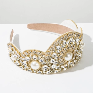 Detail of baroque headband featuring crystals and pearls on a gold base with soft lining