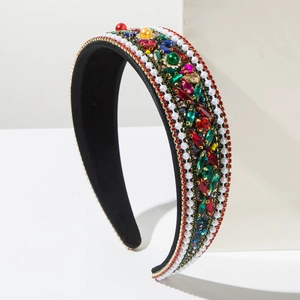 Close-up of vintage baroque headband with colorful rhinestones and double-row pearls
