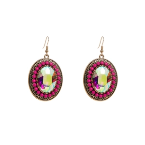 Detail of vintage bohemian earrings with iridescent rhinestones and bronze carving