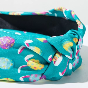 Detail of Easter knotted headband with colorful egg prints and bunny ear patterns
