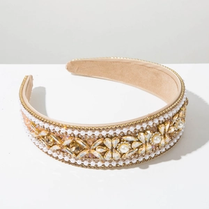 Close-up of luxury Baroque padded headband with pearls and sparkling champagne crystals