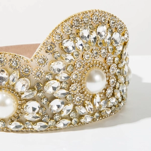 Macro detail of Baroque headband with sparkling crystals and elegant white pearls