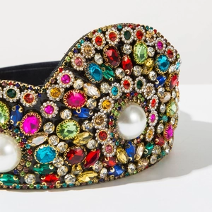 Macro detail of Baroque headband featuring multi-color crystals and large white pearls