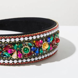 Macro detail of Baroque headband featuring colorful rhinestones and white faux pearls
