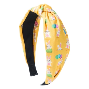 Easter knotted headband in yellow with bunny and egg prints for festive hair styling