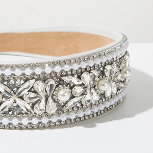Macro shot of baroque headband with crystals, faux pearls, and non-slip suede lining