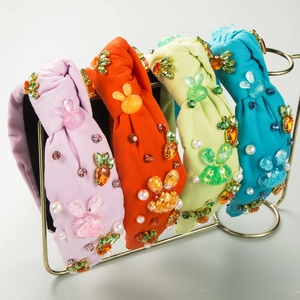 Detailed close-up of four colorful Easter knotted headbands with rhinestones and bunnies