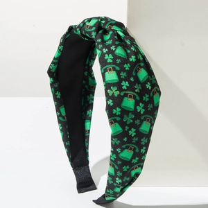 Detail of St. Patrick's Day wide knot headband with green shamrock and leprechaun hat pattern