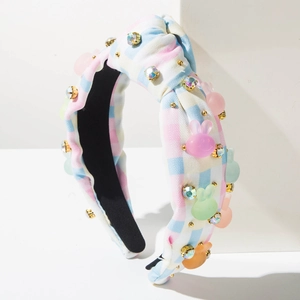 Detail view of Easter headband featuring pastel checkered fabric with crystal beads and bunnies