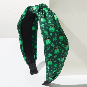 Close-up of St. Patrick's Day headband with green shamrocks and leprechaun hat prints
